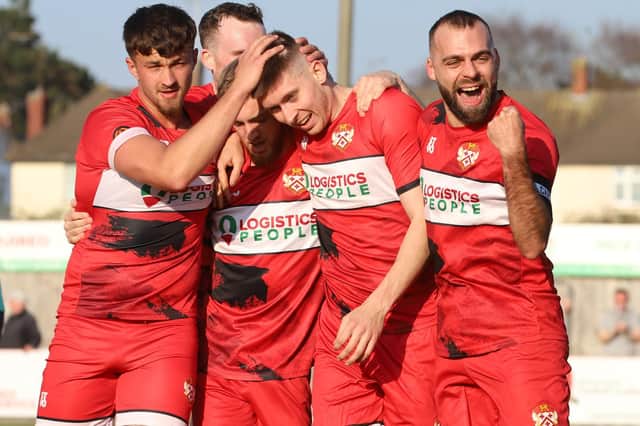 Connor Johnson takes the congratulations after he scored what proved to be the winner in Kettering Town's 2-1 victory over Chorley. Pictures by Peter Short