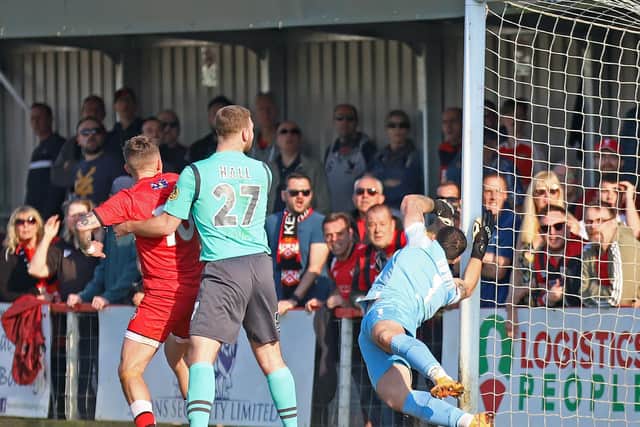 Chris Smith's shot flies into the net to give the Poppies the lead