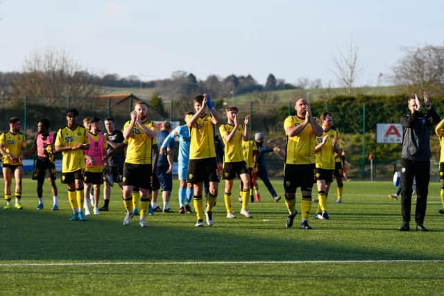Andy Burgess and the AFC Rushden & Diamonds players applaud the travelling fans after their 3-1 win at Redditch United