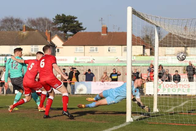 Connor Johnson heads home what proved to be the winner in the Poppies' 2-1 success over Chorley at Latimer Park