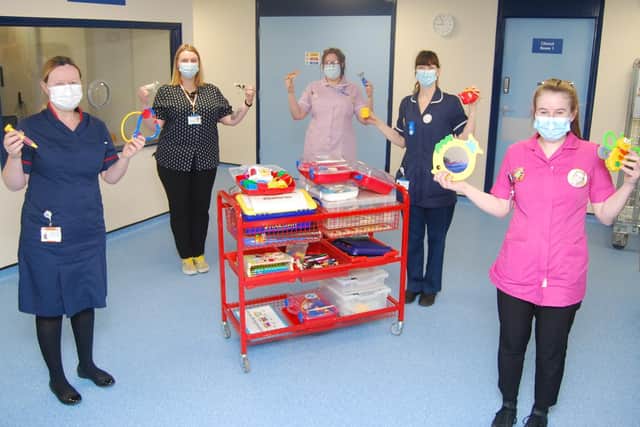 L-R Matron for Outpatients Siobhan Roe, Receptionist, Jill Devlin, Healthcare Assistant, Michala Stronner, Deputy Sister, Judith McGrenaghan, and Play Specialist, Charlotte Dayman with a distraction toy trolley