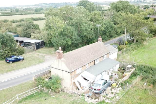 The cottage and the car that crashed into the home was wedged for four months