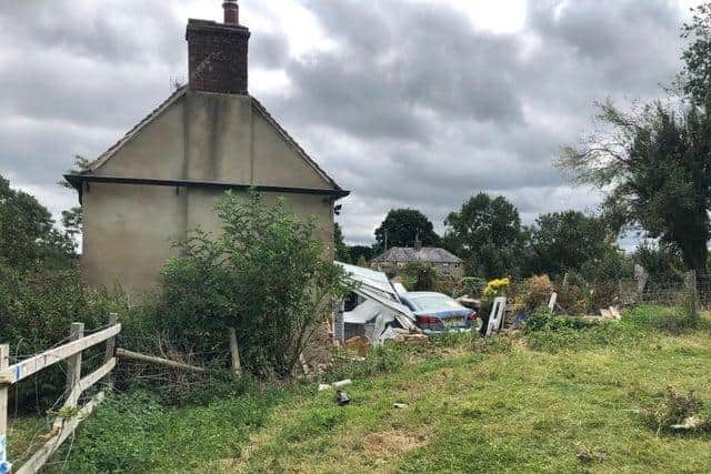 The Lexus car missed the bend, smashed through a wooden fence, through a wall, did a 360 degree turn smashing the conservatory and ended up in the back garden
