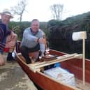 L-r Giles Darby and Jon Wells with the canoe complete with beer pump