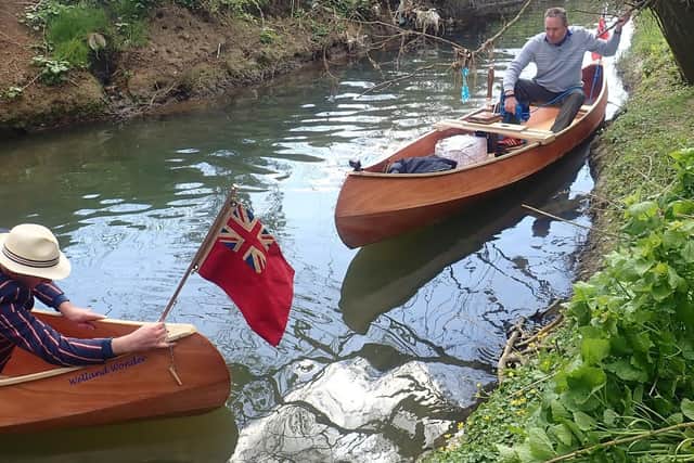 Giles places the Red Ensign on his Welland Wonder canoe