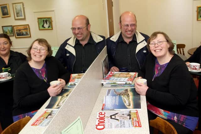 Cransley Hospice Coffee Shop first anniversary: customers, Darren and Kate Wills, being served by Louise Rose in April 2013