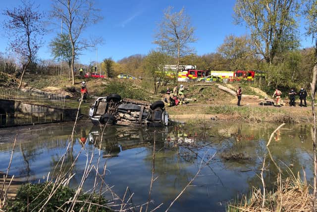The car left the road and plunged down the embankment into Corby Boating Lake