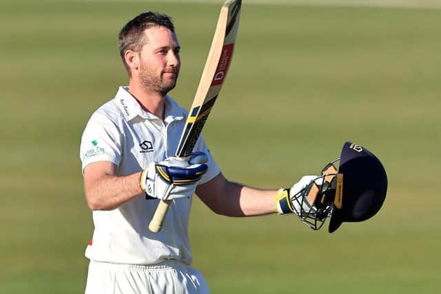 Glamorgan's Chris Cooke celebrates reaching his century