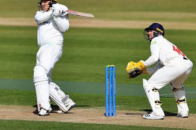 Adam Rossington hits out on his way to 76