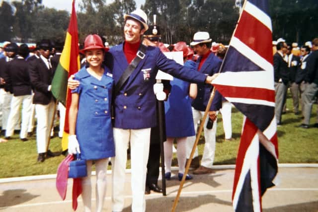Anita in her opening ceremony dress with Lynn Davies gold-medal winning long jumper