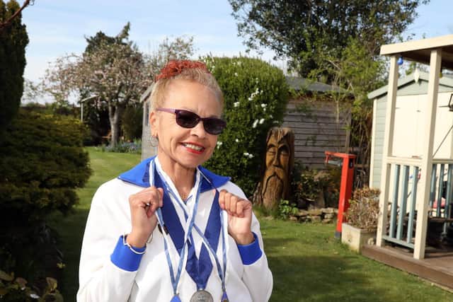 Anita Neil with her bronze and silver medals