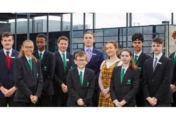 Staff and pupils at Corby Business Academy.