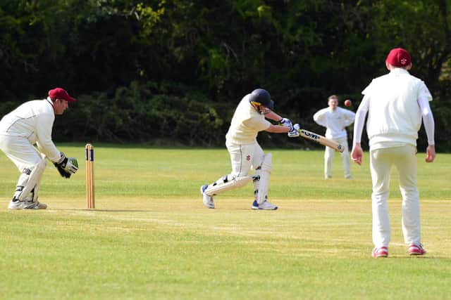 Cogenhoe IIs' Liam Morrisey goes on the attack against Obelisk