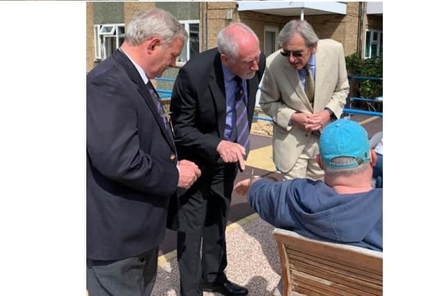 Freemasons Andrew Ward, David Burton and Gerry Crawford meeting Deafblind UK members