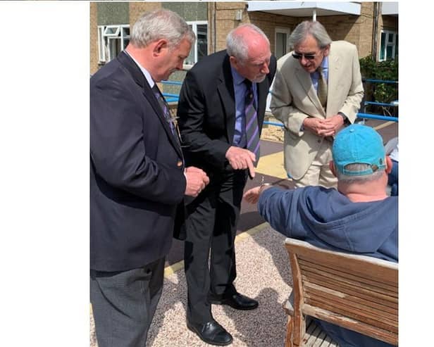 Freemasons Andrew Ward, David Burton and Gerry Crawford meeting Deafblind UK members