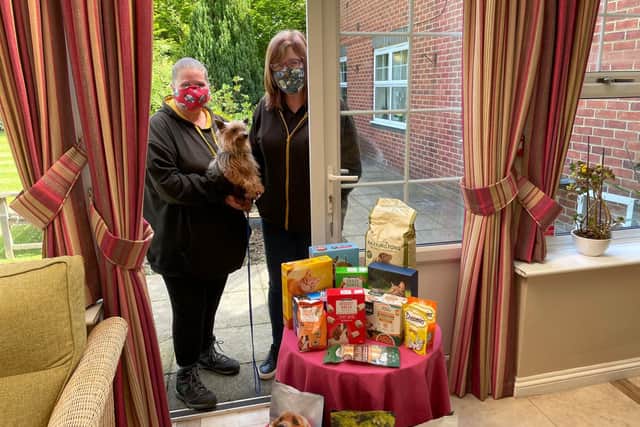 The ladies from Lainys Rescue with the food donations