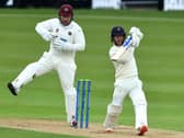 Alex Davies tries to force a shot off the bowling of Tom Taylor
