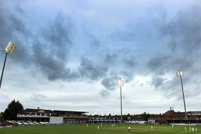 The floodlights were on from the start of a grim day at the County Ground