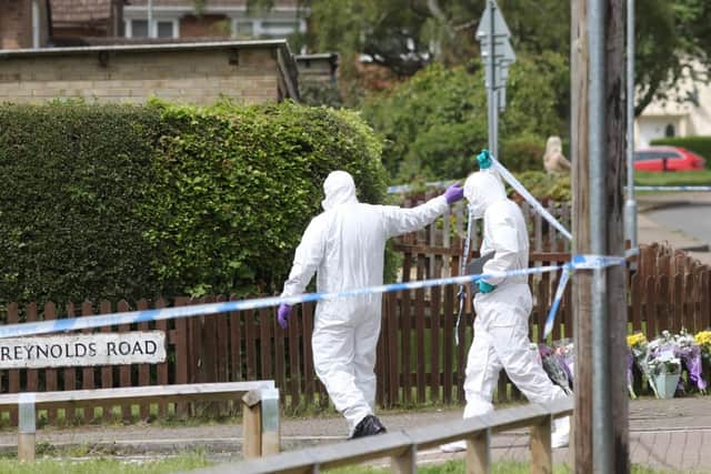 Forensics officers at the scene.