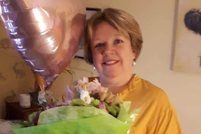 Moira Bovenzi with her bouquet of flowers