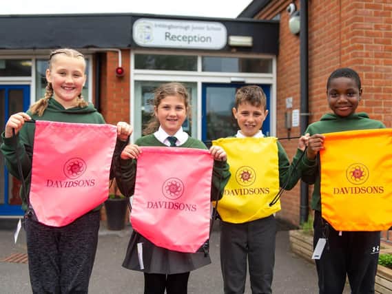 Irthlingborough Junior School pupils with the donated hi-vis bags
