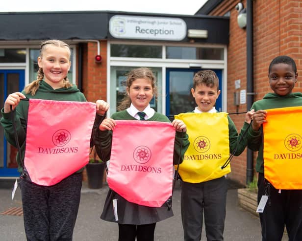 Irthlingborough Junior School pupils with the donated hi-vis bags