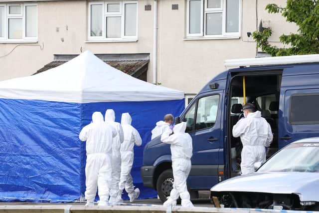 Officers go into a house in Reynolds Road