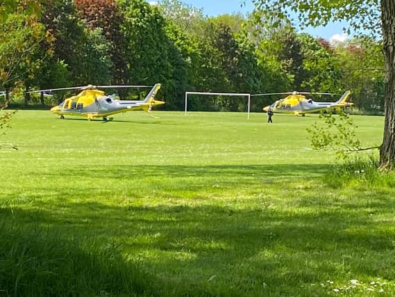 Two air ambulances are on the scene at Abington Park