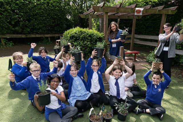 Pupils from St Andrew's Primary with Yvette Christy from Tilia Homes