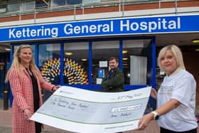 Michelle Hollis, marketing manager of Barratt Northampton (left), handing the cheque over to Robert and Lorraine of Northampton Health Charity