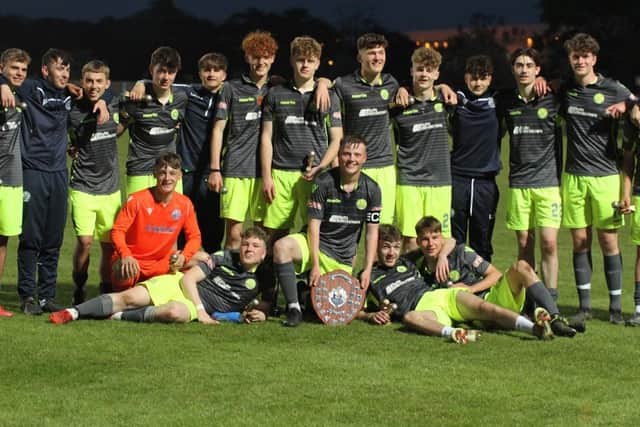 AFC Rushden & Diamonds celebrate after their Jaymann Shield success over Kettering Town. Picture by Finbarr Carroll