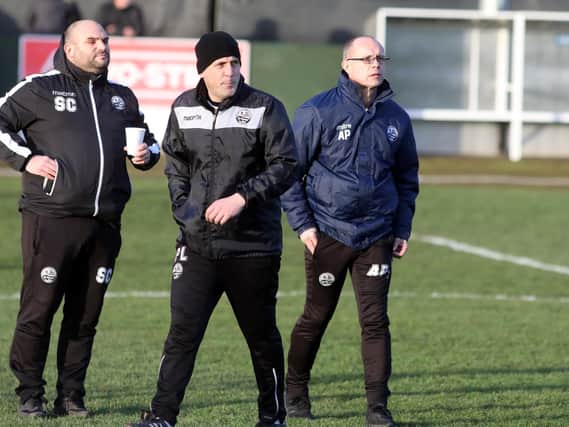 Paul Lamb (centre), who was previously assistant-manager at AFC Rushden & Diamonds alongside Andy Peaks, has been appointed as the new boss of Wellingborough Town