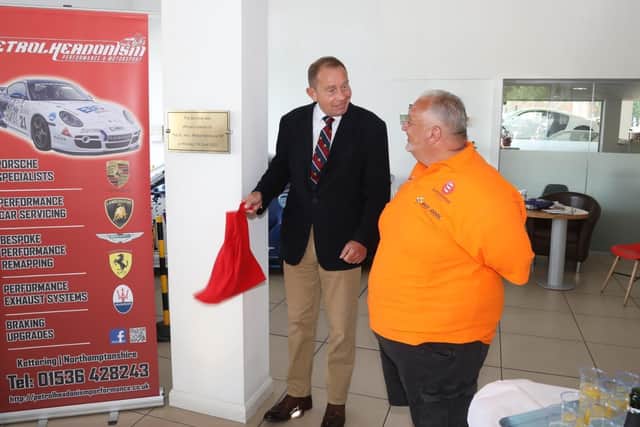 Philip Hollobone MP unveils a plaque with Bee Cool founder and chairman David Fry