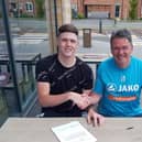 Goalkeeper Rhys Davies put the final touches on his move to Kettering Town along with Poppies assistant-manager John Ramshaw. Picture courtesy of Poppies Media