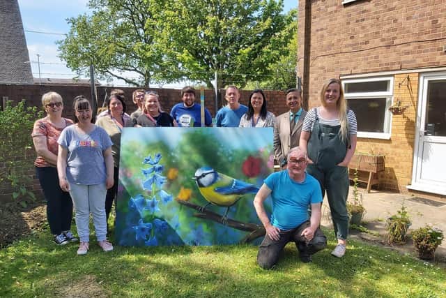 The team at Mind Corby with one of the wildlife panels