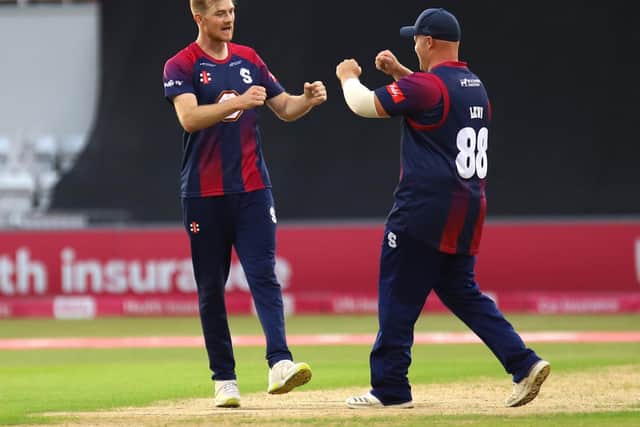 Tom Taylor celebrates one of his three wickets with Richard Levi (PIctures: Peter Short)