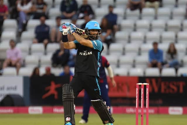Moeen Ali cracks a bounday on his way to his 50
