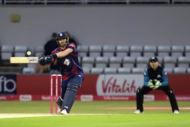 Graeme White goes for a big hit