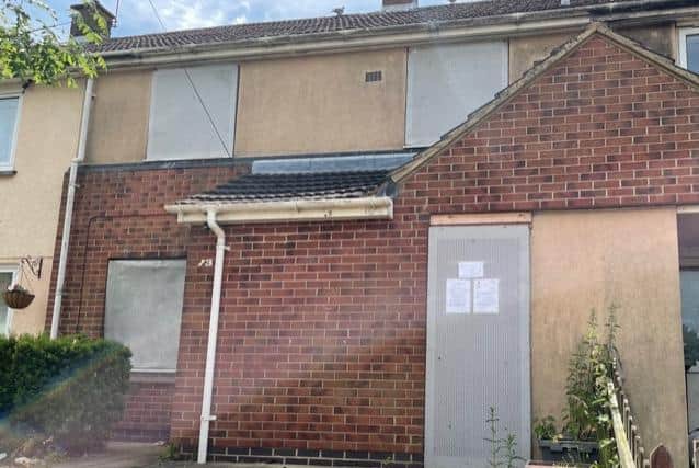 The boarded-up home in Buckfast Square