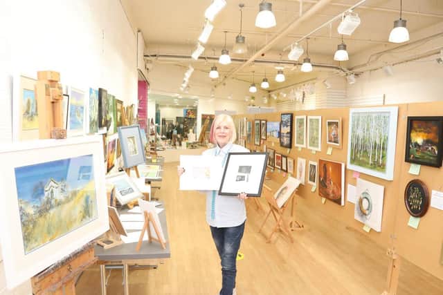 Maura Bright with the gallery and some of her artwork