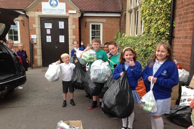 Children handed over the cans to the organisers