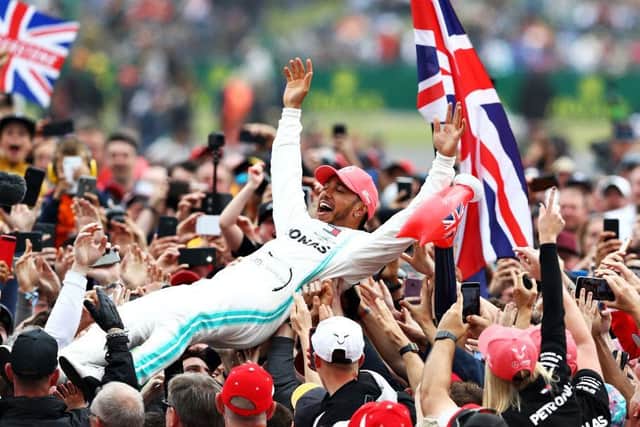 Lewis Hamilton celebrates with fans after winning the British Grand Prix at Silverstone in 2019 - the last one with spectators before the coronavirus pandemic. Photo: Getty Images