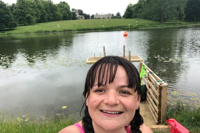 The look of happiness after a relaxing open water swim, surrounded by beautiful scenery.