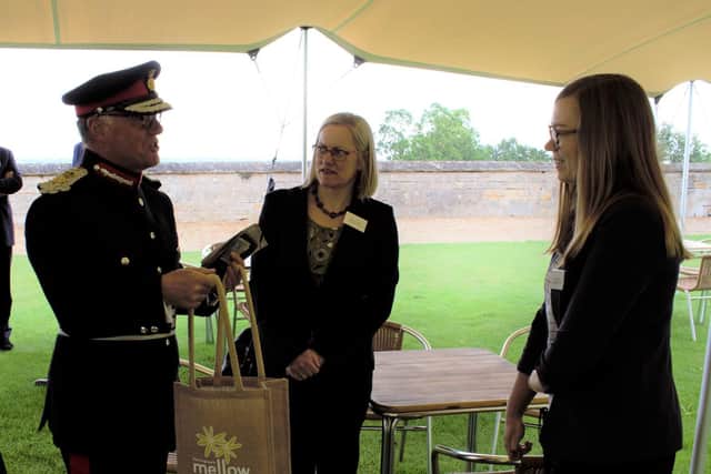 Rachel Lindsay and Gina Lewis of Queen's Award for Enterprise winners Farrington Oils with Lord-Lieutenant of Northamptonshire James Saunders Watson at Rockingham Castle