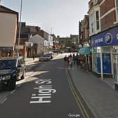Police are hunting three masked men who stole a wallet near Boots in Rushden town centre on Friday