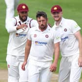 Simon Kerrigan is congratulated by Emilio Gay (left) and Tom Taylor after claiming one of his four wickets against Yorkshire