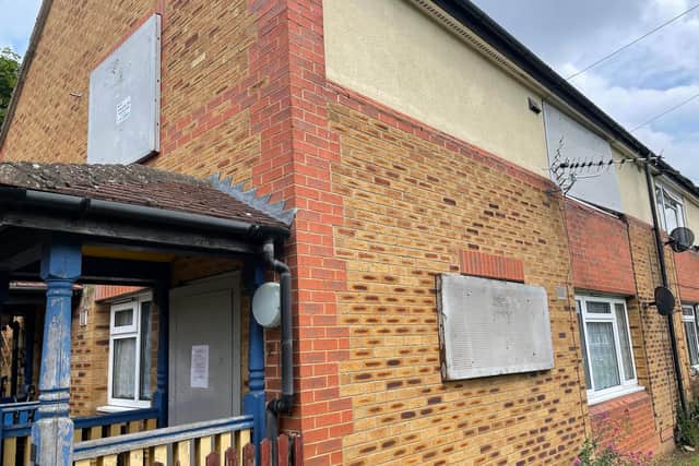 The first floor flat is boarded up
