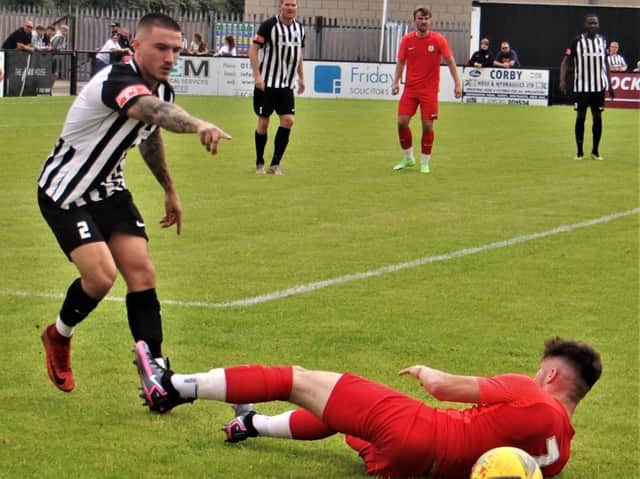 Callum Westwood in action during Corby Town's 4-2 friendly win over Melton Town at Steel Park. Pictures by David Tilley