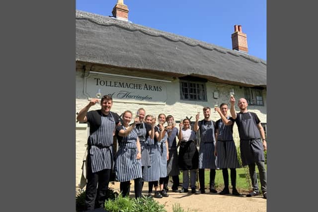 The Tollemache Arms team celebrate