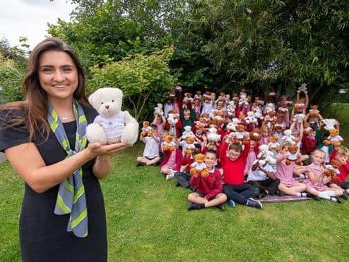 Barratt Homes Sales Adviser, Emma, with some of the Year 1 pupils at Oakley Vale Primary School with their new bears